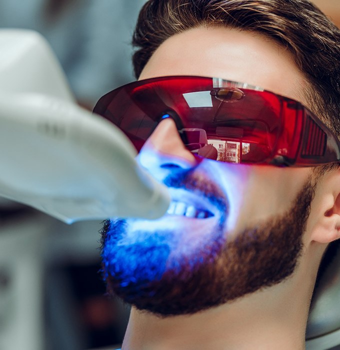 Closeup of man getting teeth whitening treatment
