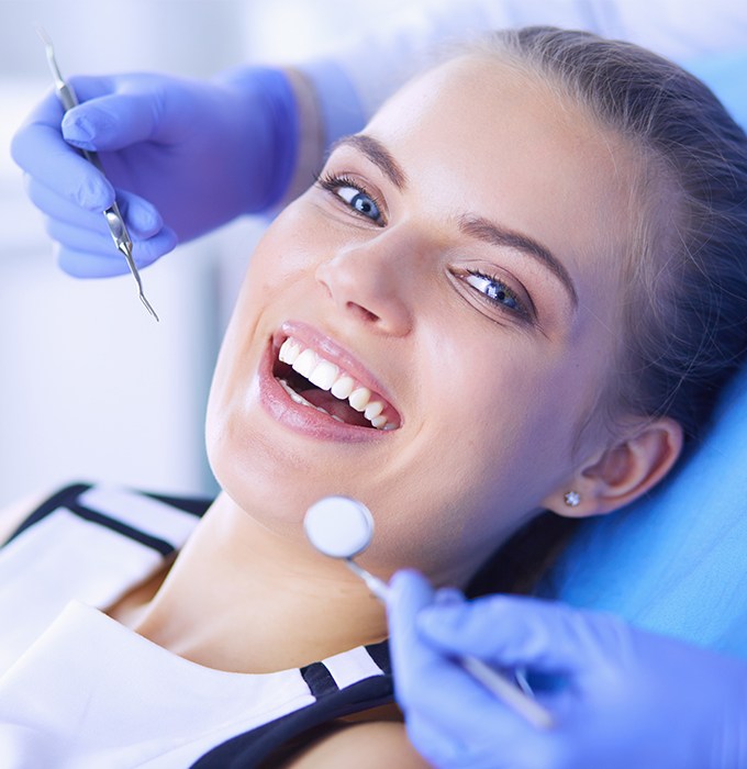 Patient smiling after one visit dental restoration