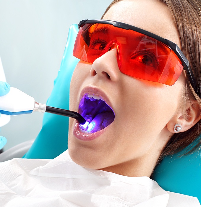 Patient receiving dental sealants