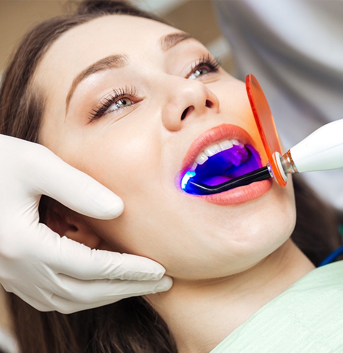 Woman receiving dental bonding treatment