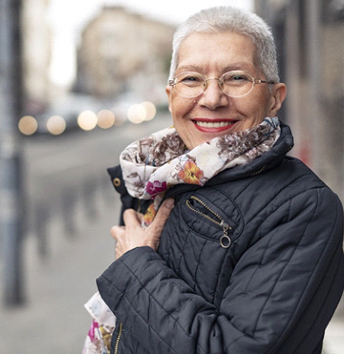 Woman smiling with dentures in Lansing