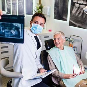 Woman smiling during her dental appointment