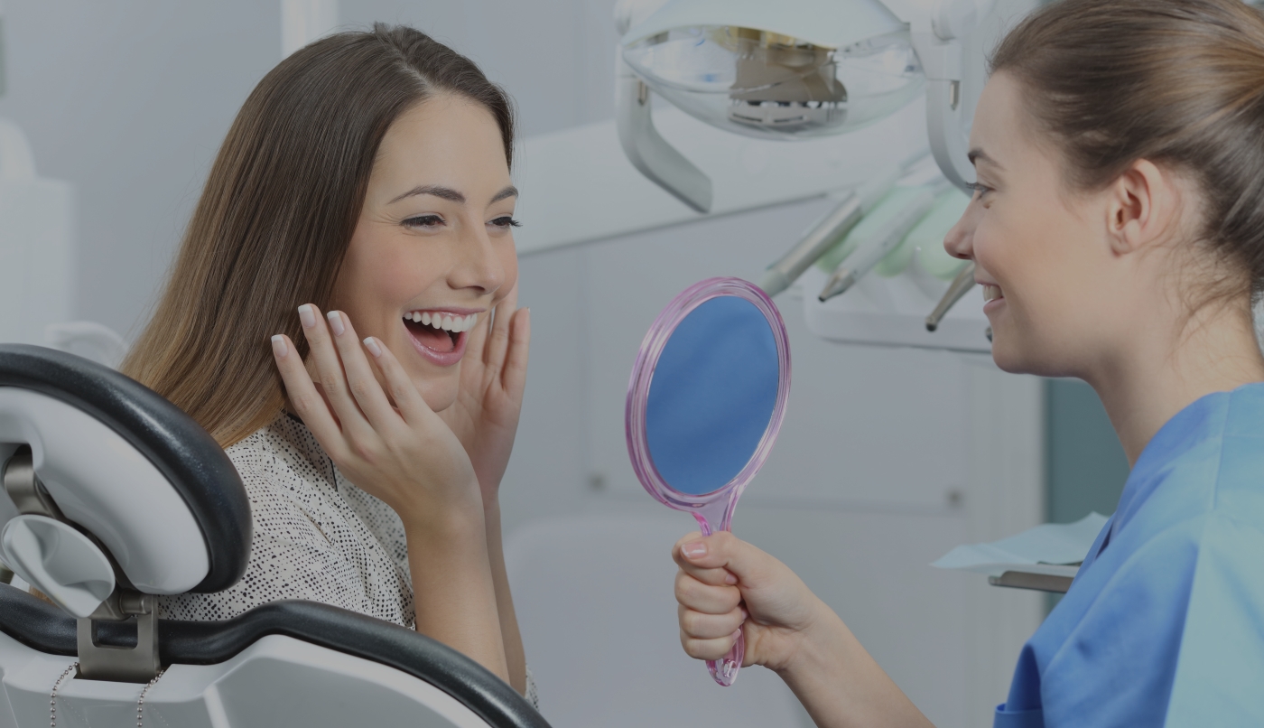 Patient looking at smile in mirror