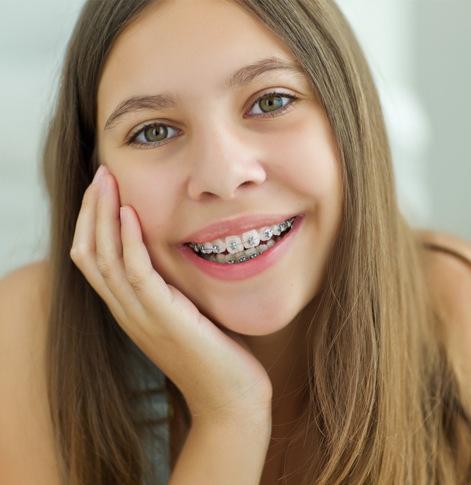 Teen girl with traditional orthodontics