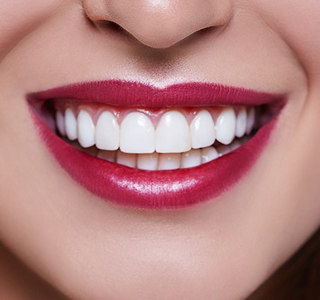 Closeup of healthy smile after gum disease treatment