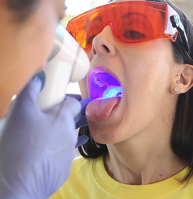 Patient receiving oral cancer screening