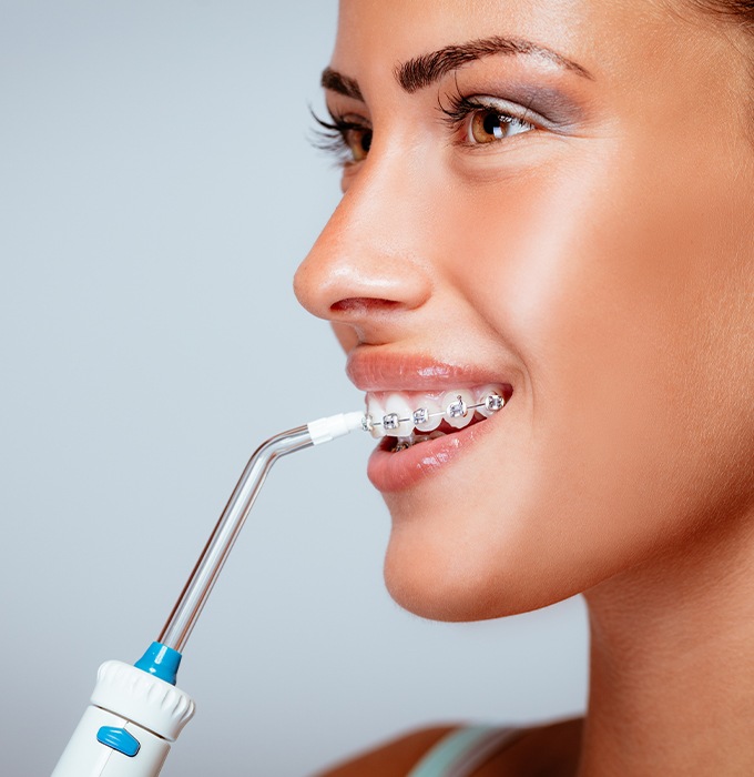 Patient receiving at home dental hygiene treatment
