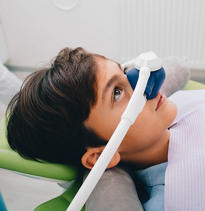 Patient with nitrous oxide dental sedation mask