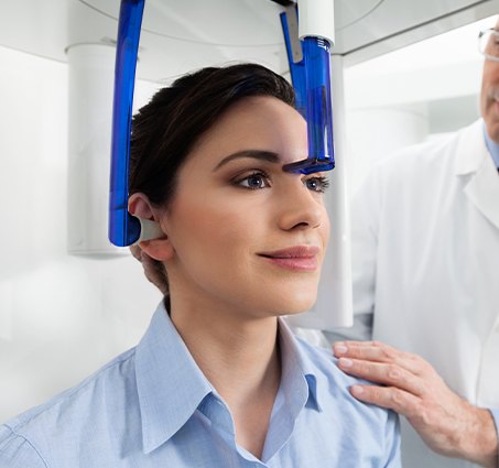 Woman receiving 3 D C T cone beam x-ray scans