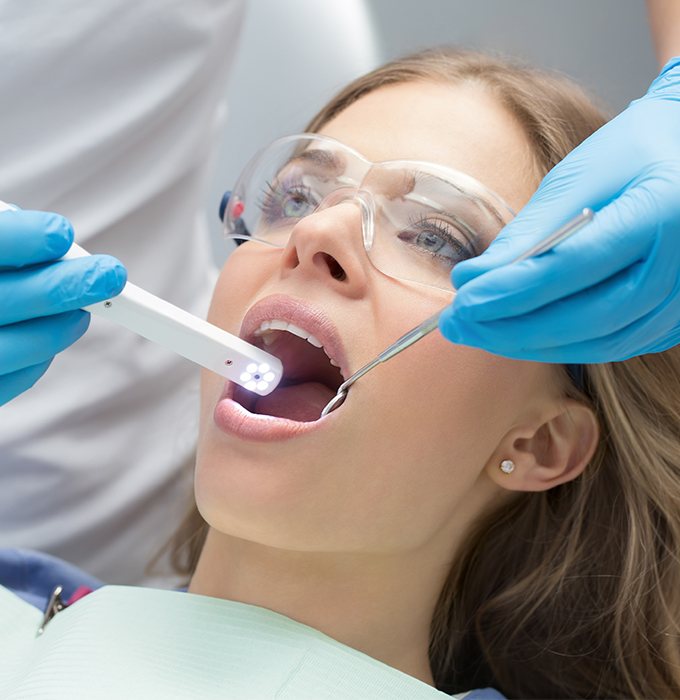 Dentist using intraoral camera to capture smile images