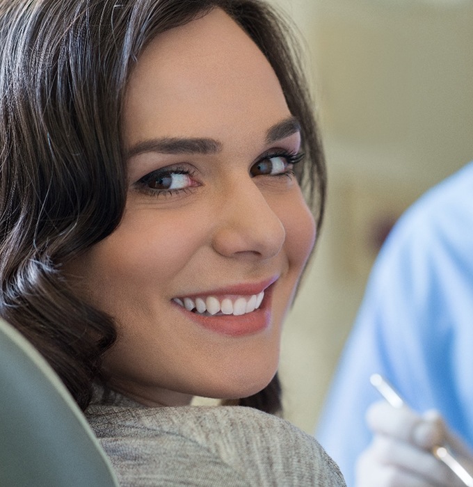 Woman smiling in dentist's treatment chair